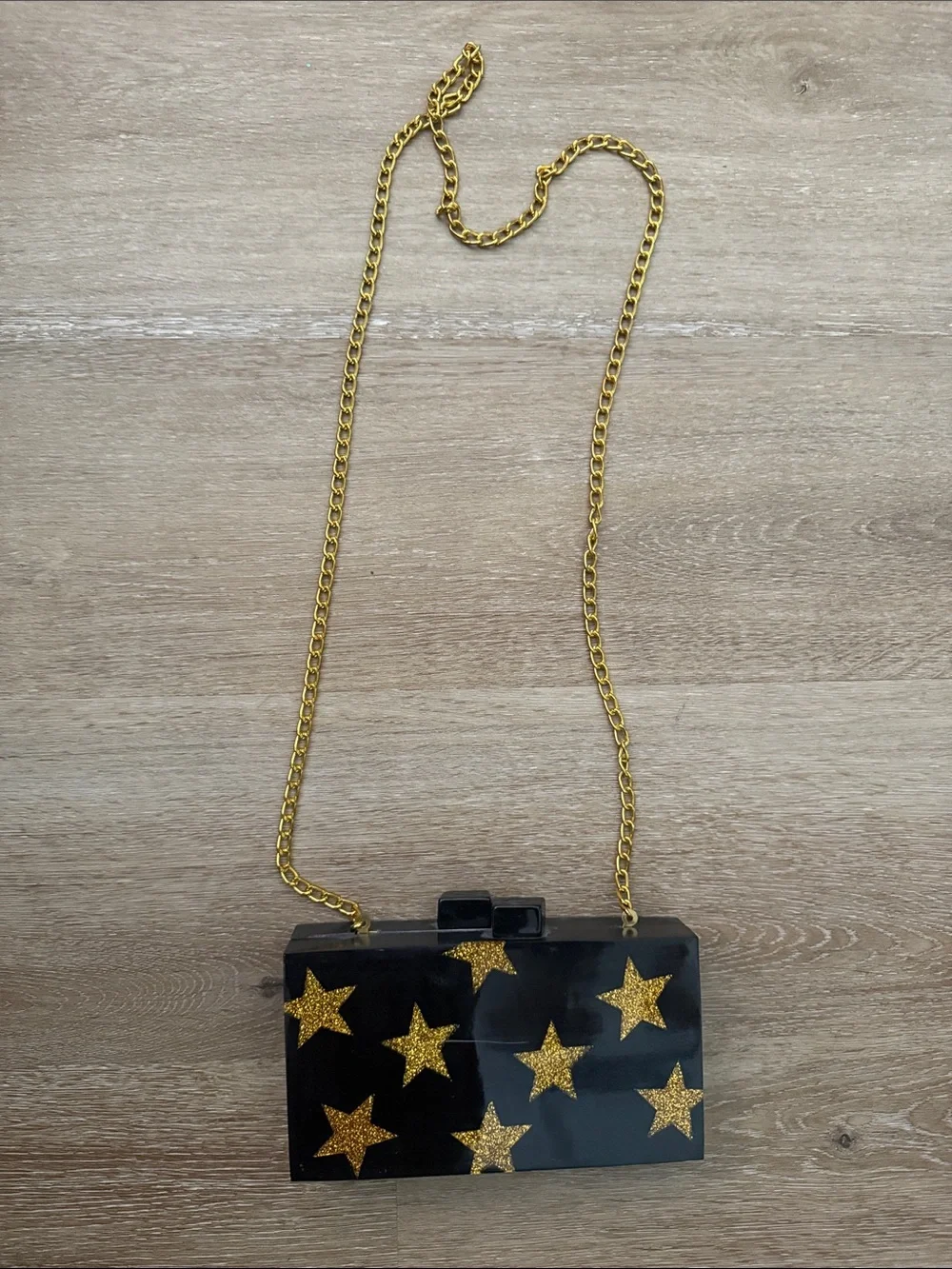 Lulu celestial Black and gold Acrylic Star Clutch with Gold Chain crossbody stra